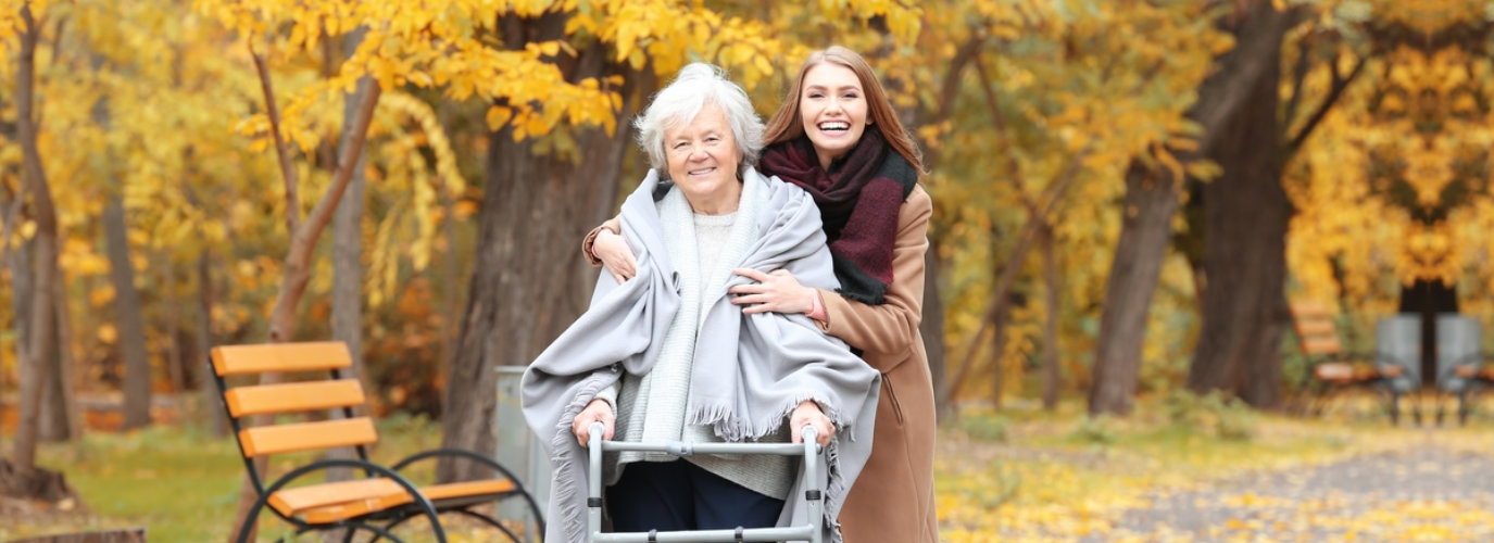 senior woman and adult woman walking